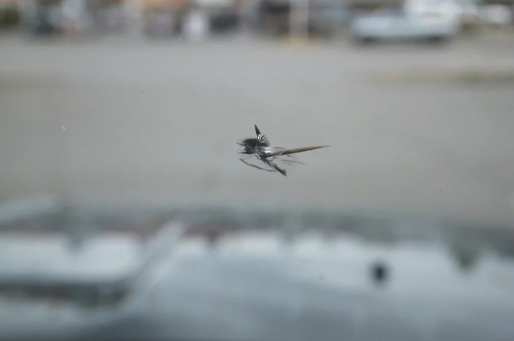 A repairable windshield rock chip